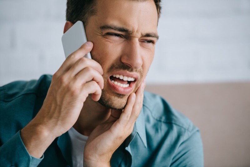 young-man-talking-by-smartphone